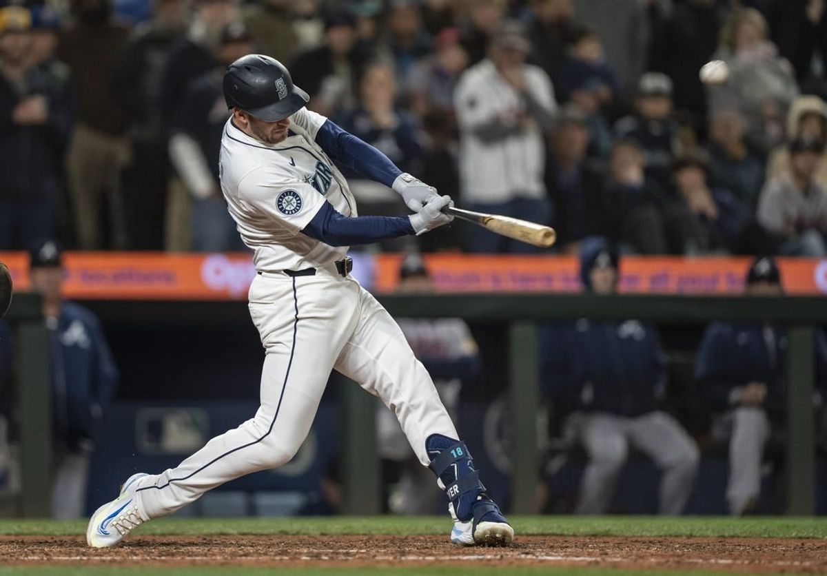 Apr 29, 2024; Seattle, Washington, USA; Seattle Mariners designated hitter Mitch Garver (18) hits a two-run home run during the ninth inning against the Atlanta Braves at T-Mobile Park.