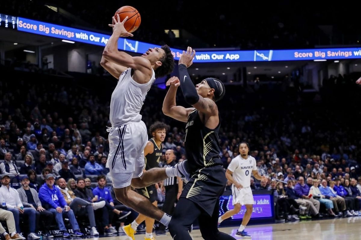 Nov 27, 2023; Cincinnati, Ohio, USA; Xavier Musketeers guard Desmond Claude (1) shoots against Oakland Golden Grizzlies guard Isaiah Jones (7) in the first half at Cintas Center.