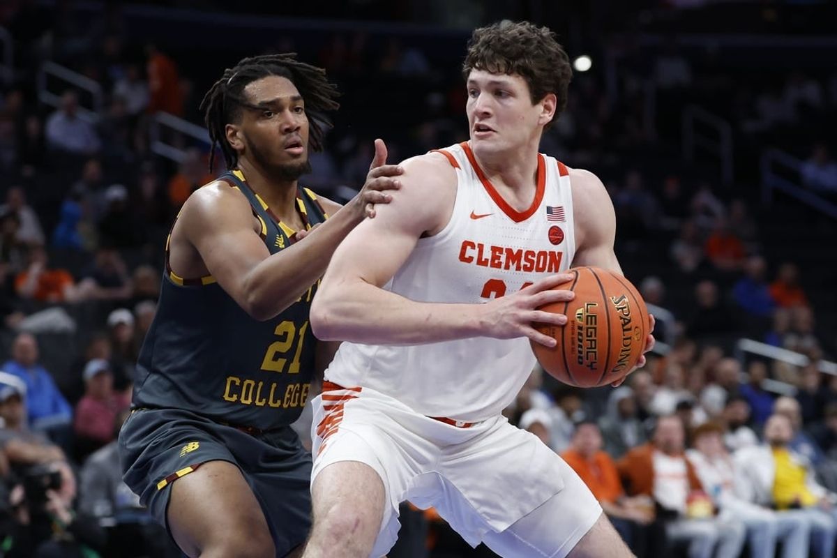Mar 13, 2024; Washington, D.C., USA; Clemson Tigers center PJ Hall (24) drives to the basket as Boston College Eagles forward Devin McGlockton (21) defends in the second half at Capital One Arena.