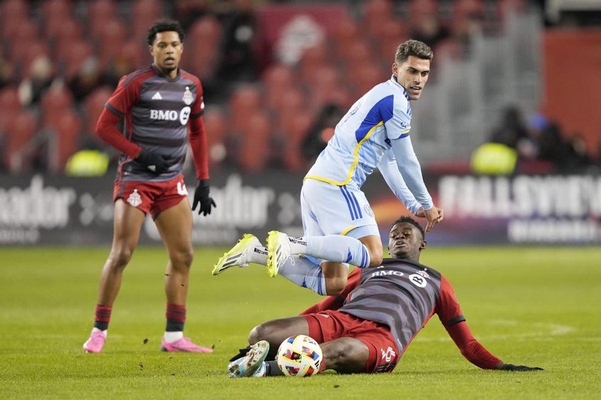 Mar 23, 2024; Toronto, Ontario, USA; Atlanta United forward Daniel Rios (19) fights for the ball Toronto FC defender Aime Mabika (6) during the second half at BMO Field.