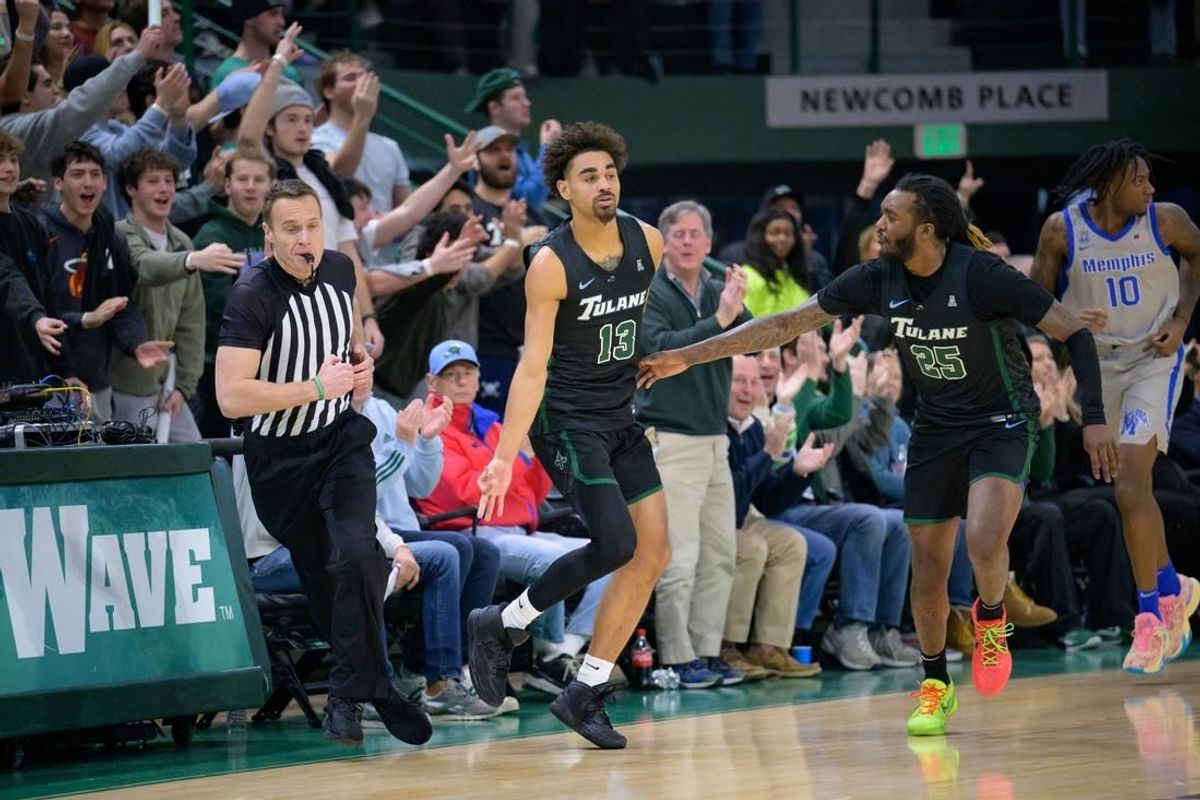Jan 21, 2024; New Orleans, Louisiana, USA; Tulane Green Wave guard Tre' Williams (13) celebrates a three point basket against the Memphis Tigers during the first half at Avron B. Fogelman Arena in Devlin Fieldhouse.
