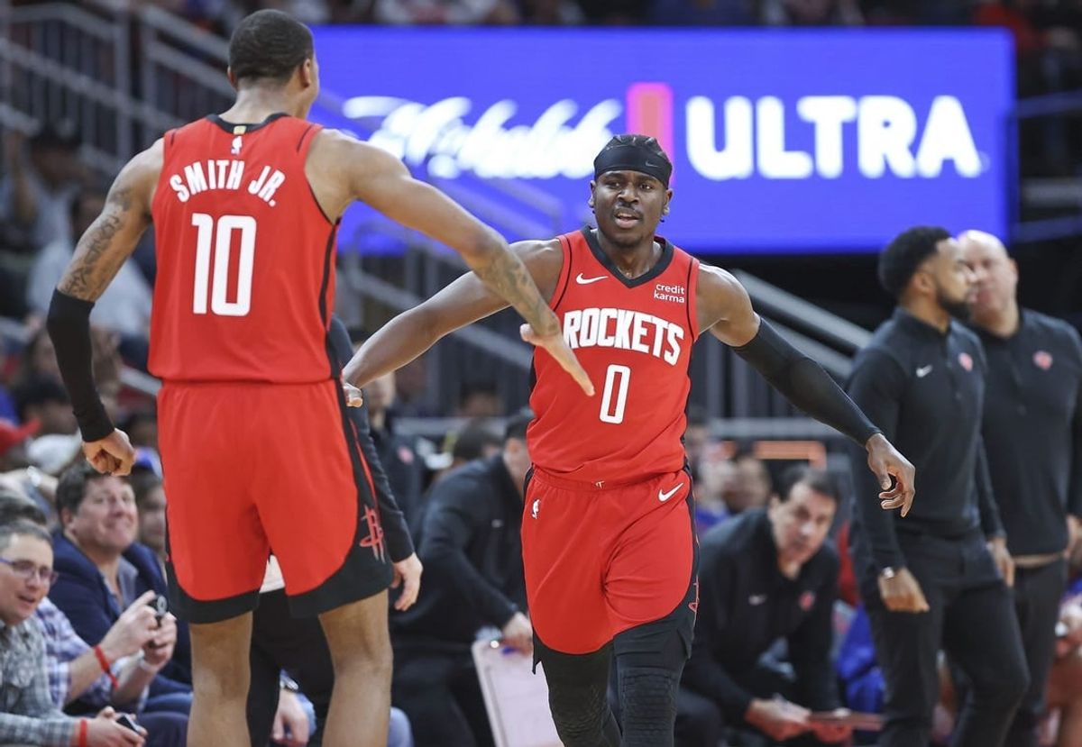 Feb 12, 2024; Houston, Texas, USA; Houston Rockets guard Aaron Holiday (0) celebrates with forward Jabari Smith Jr. (10) after a play during the fourth quarter against the New York Knicks at Toyota Center.