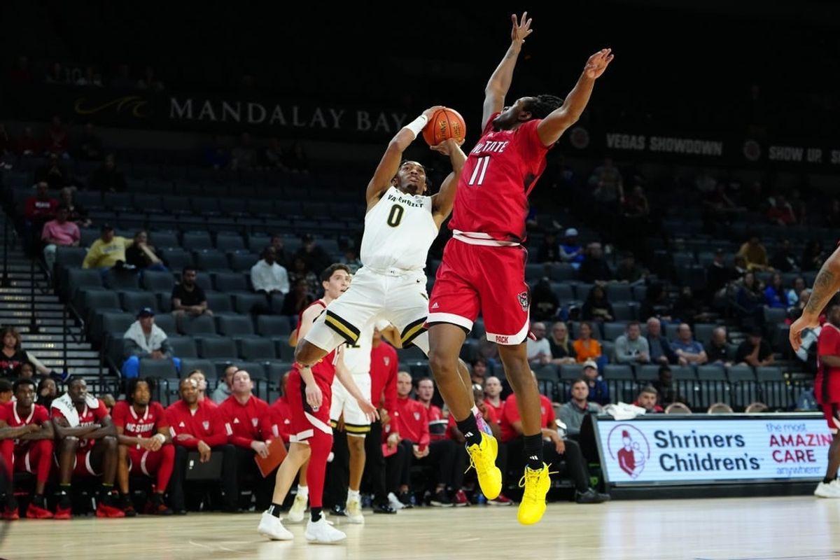 Nov 23, 2023; Las Vegas, Nevada, USA; Vanderbilt Commodores guard Tyrin Lawrence (0) shoots against North Carolina State Wolfpack guard Dennis Parker Jr. (11) during the first half at Michelob Ultra Arena.