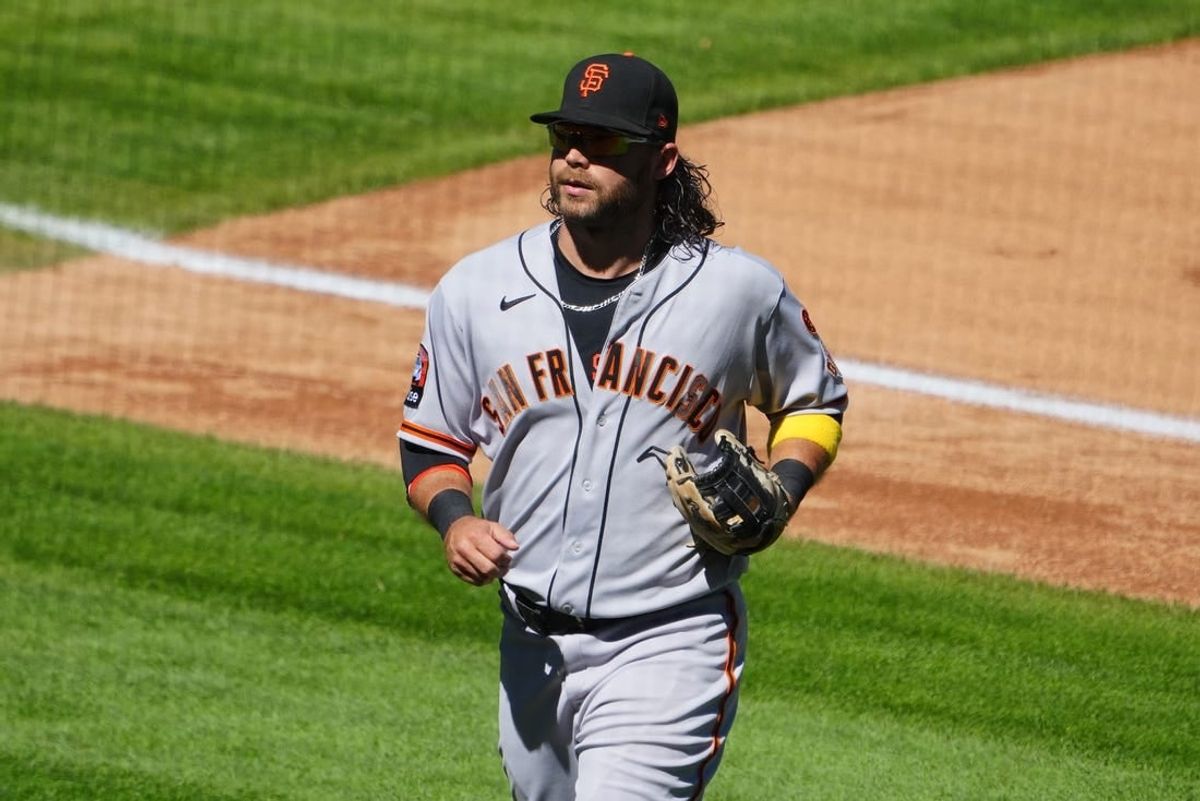 Sep 17, 2023; Denver, Colorado, USA; San Francisco Giants shortstop Brandon Crawford (35) leaves the field in the fourth inning against the Colorado Rockies at Coors Field.
