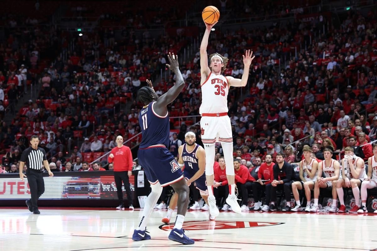 Feb 8, 2024; Salt Lake City, Utah, USA; Utah Utes center Branden Carlson (35) shoots over Arizona Wildcats center Oumar Ballo (11) during second overtime at Jon M. Huntsman Center.