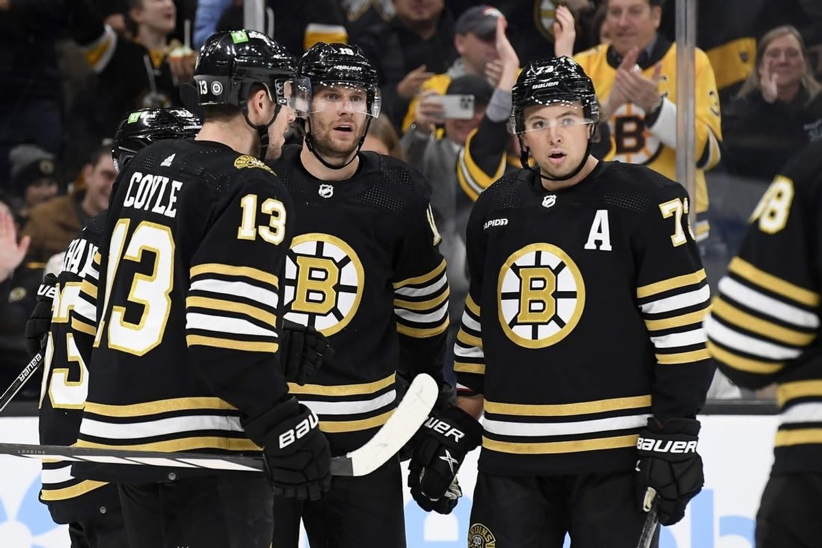 Nov 30, 2023; Boston, Massachusetts, USA; Boston Bruins center Pavel Zacha (18) celebrates his goal with center Charlie Coyle (13) and defenseman Charlie McAvoy (73) during the third period against the San Jose Sharks at TD Garden.