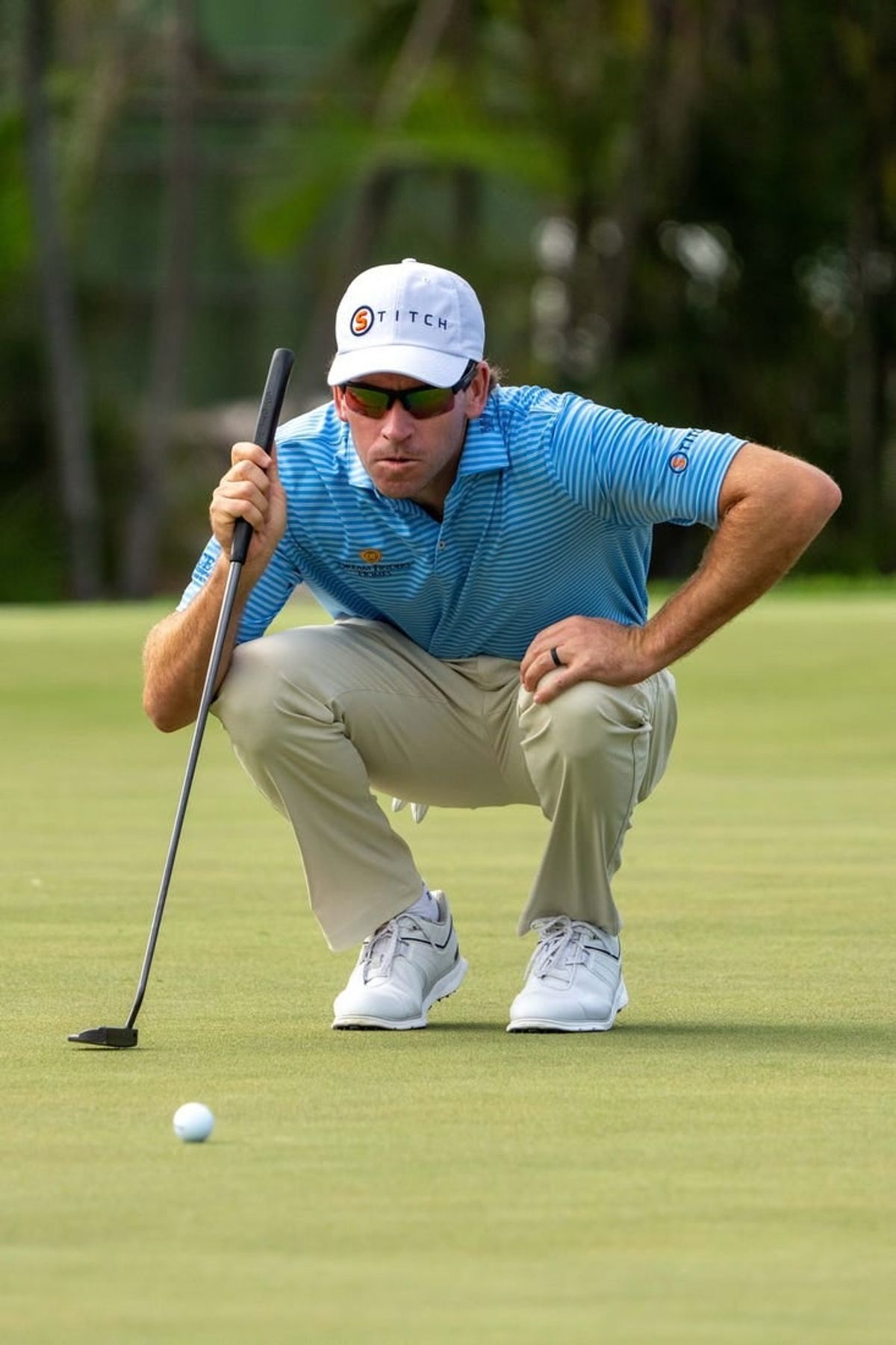 January 13, 2024; Honolulu, Hawaii, USA; Ben Kohles lines up his putt on the first hole during the third round of the Sony Open in Hawaii golf tournament at Waialae Country Club.