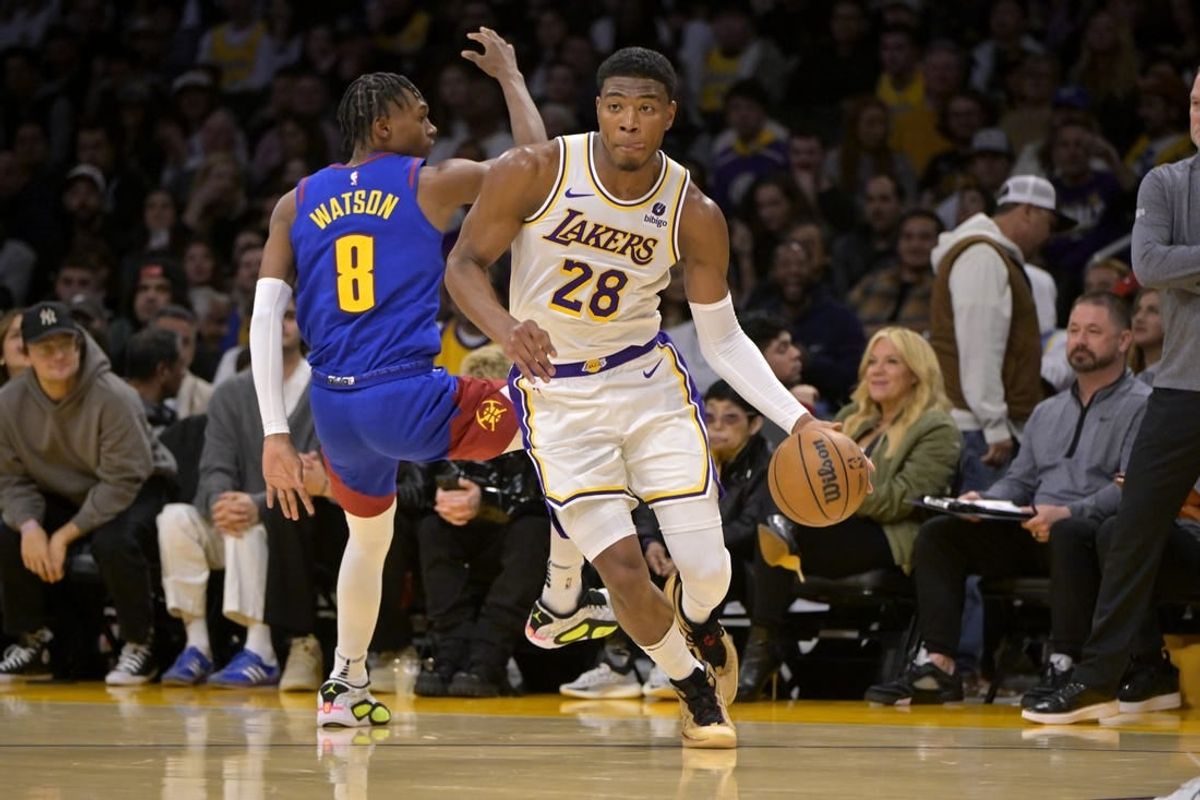 Mar 2, 2024; Los Angeles, California, USA;  Los Angeles Lakers forward Rui Hachimura (28) drives past Denver Nuggets guard Christian Braun (0) in the second half at Crypto.com Arena.