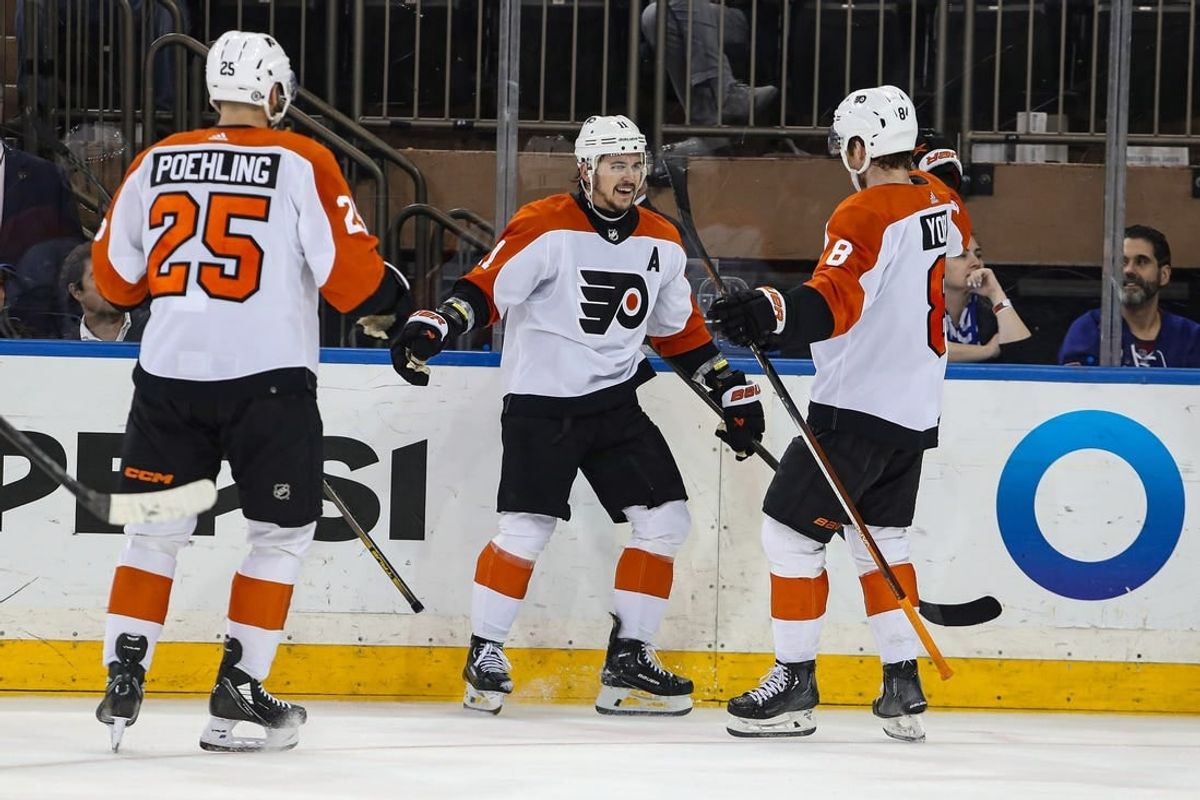 Apr 11, 2024; New York, New York, USA; Philadelphia Flyers center Travis Konecny (11) celebrates his goal with defenseman Cam York (8) during the second period against the New York Rangers at Madison Square Garden.