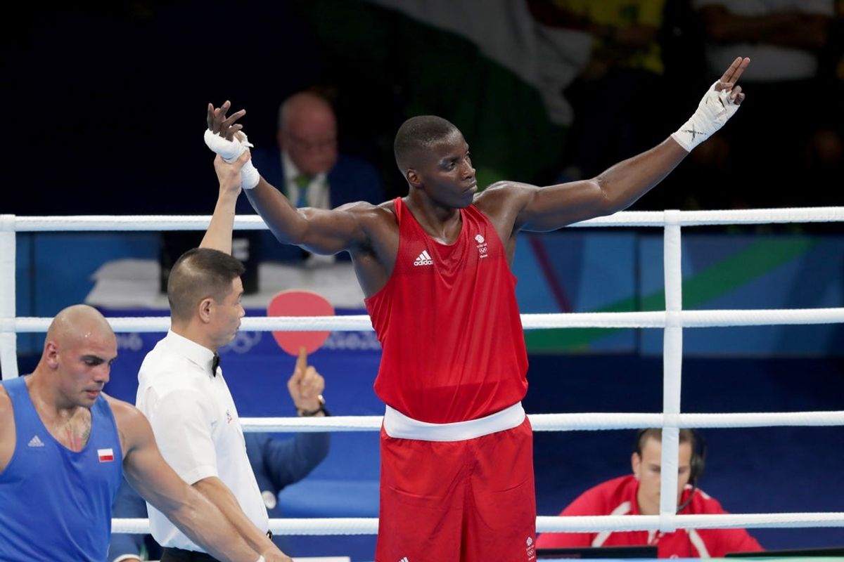 Aug 6, 2016; Rio de Janeiro, Brazil; Lawrence Okolie (GBR, red) reacts after defeating Igor Pawel Akubowski (POL, blue) in their men's heavy preliminary bout at Riocentro - Pavilion 6 during the Rio 2016 Summer Olympic Games. Mandatory Credit: Dan Powers-Imagn Images