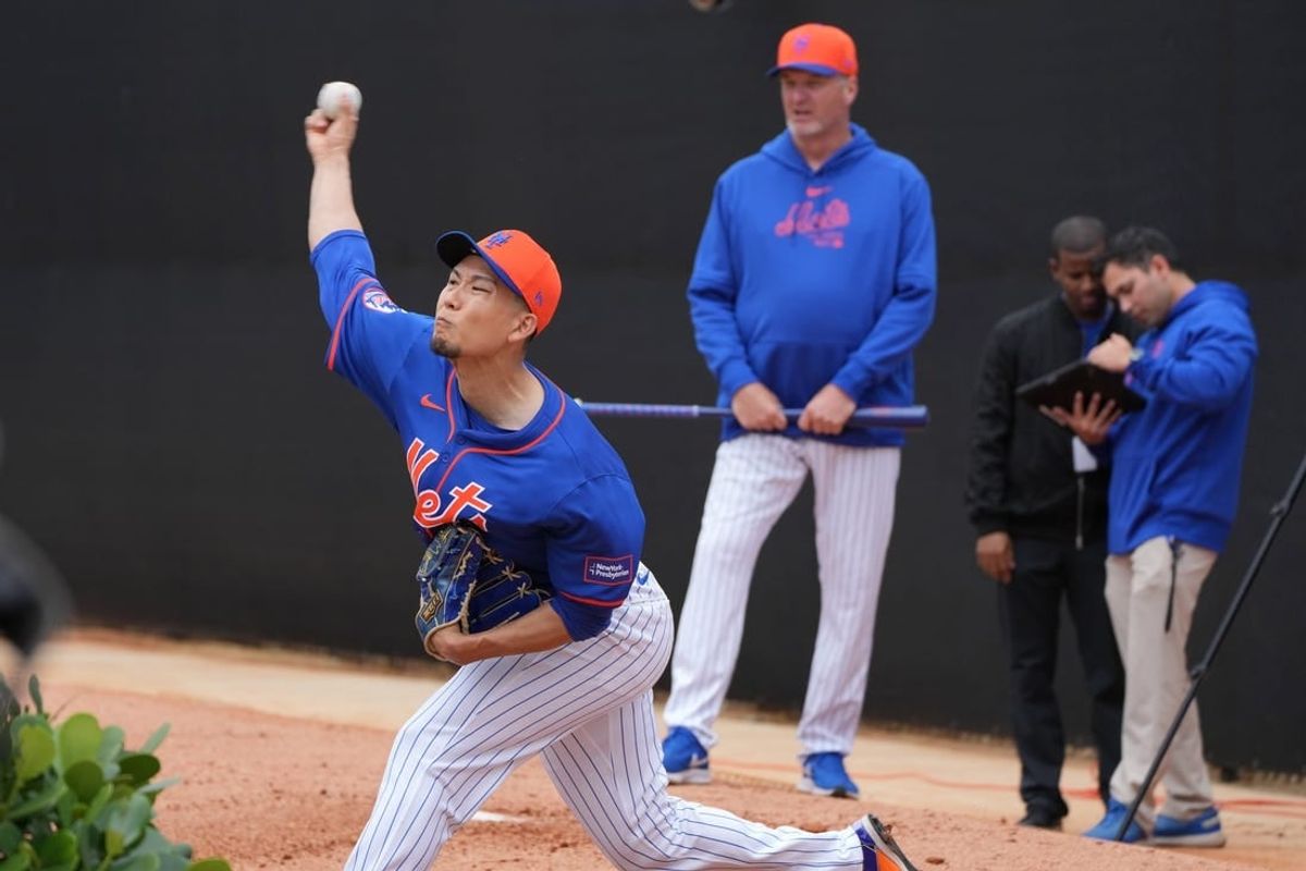 Feb 19, 2024; Port St. Lucie, FL, USA; New York Mets starting pitcher Kodai Senga (34) warms-up during workouts at spring training.