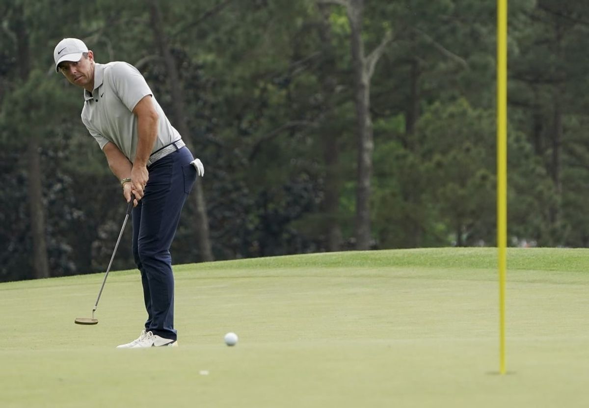 Apr 7, 2023; Augusta, Georgia, USA; Rory McIlroy putts on no. 18 during the second round of The Masters golf tournament.