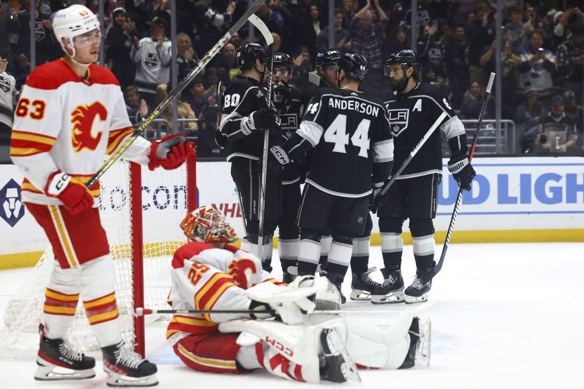 Dec 23, 2023; Los Angeles, California, USA; Los Angeles Kings right wing Alex Laferriere (78) celebrates with his teammates after scoring a goal against the Calgary Flames during the second period at Crypto.com Arena.