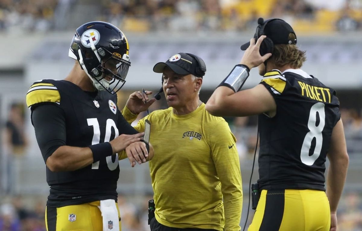Aug 19, 2023; Pittsburgh, Pennsylvania, USA;  Pittsburgh Steelers quarterbacks Mitch Trubisky (10) and Kenny Pickett (8) talk with quarterbacks coach Mike Sullivan (middle) against the Buffalo Bills during the second quarter at Acrisure Stadium.