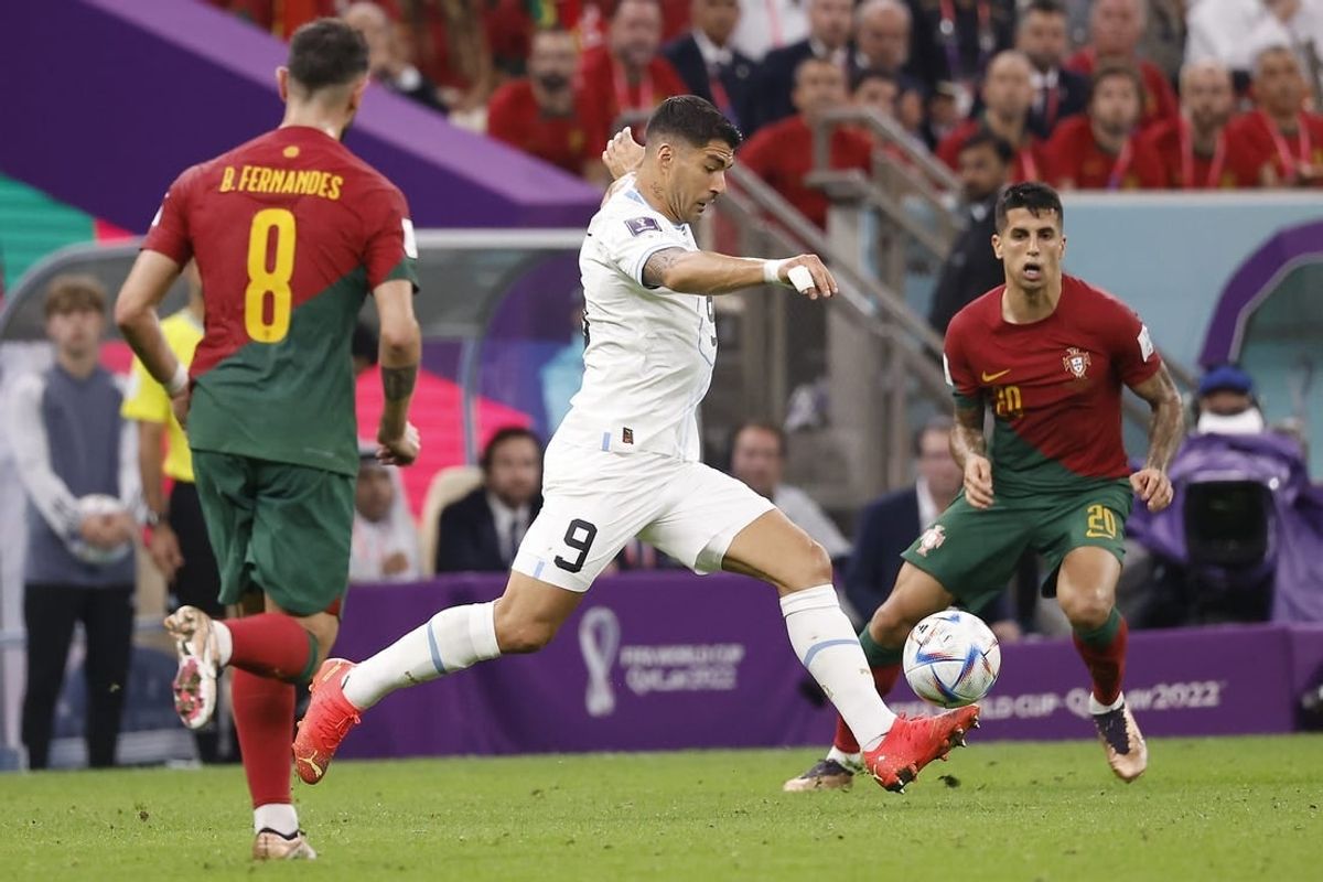 Nov 28, 2022; Lusail, Qatar; Uruguay forward Luis Suarez (9) shoots on goal against Portugal during the second half of the group stage match in the 2022 World Cup at Lusail Stadium.