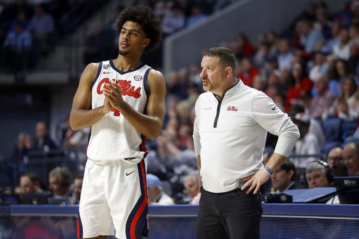 Jan 13, 2024; Oxford, Mississippi, USA; Mississippi Rebels head coach Chris Beard (right) talks with forward Jaemyn Brakefield (4) during the second half against the Vanderbilt Commodores at The Sandy and John Black Pavilion at Ole Miss.