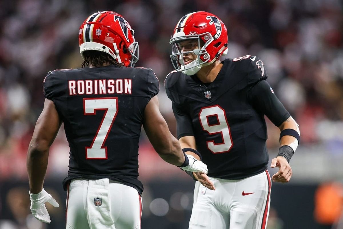 Nov 26, 2023; Atlanta, Georgia, USA; Atlanta Falcons running back Bijan Robinson (7) celebrates after a touchdown with quarterback Desmond Ridder (9) against the New Orleans Saints in the second quarter at Mercedes-Benz Stadium.