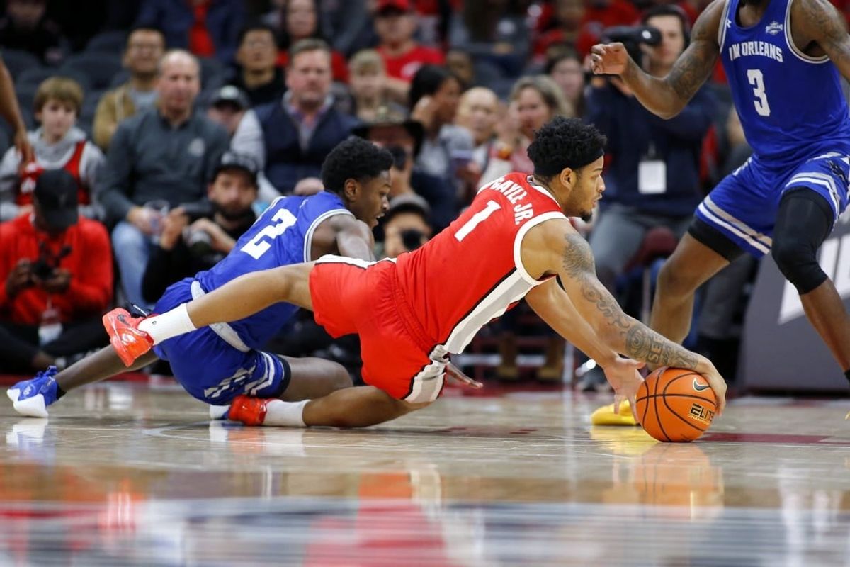 Dec 21, 2023; Columbus, Ohio, USA; Ohio State Buckeyes guard Roddy Gayle Jr. (1) dives for the ball as New Orleans Privateers guard Jah Short (2) defends during the first half at Value City Arena.