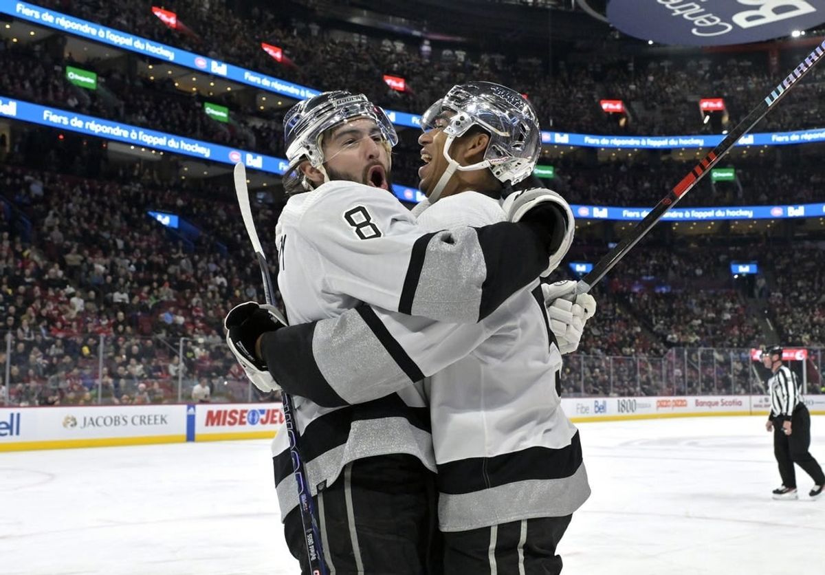 Dec 7, 2023; Montreal, Quebec, CAN; Los Angeles Kings defenseman Drew Doughty (8) celebrates with teammate forward Quinton Byfield (55) after scoring a goal against the Montreal Canadiens during the first period at the Bell Centre.
