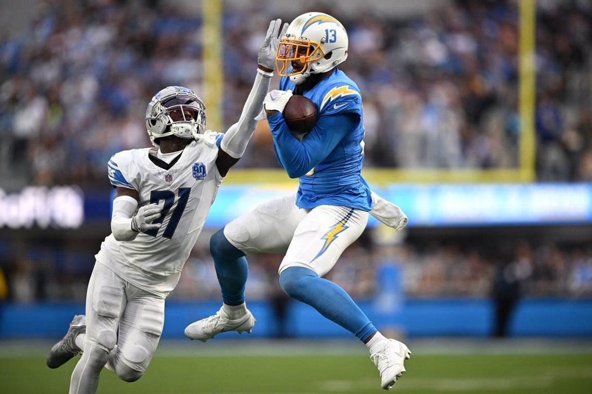 Nov 12, 2023; Inglewood, California, USA; Los Angeles Chargers wide receiver Keenan Allen (13) makes a catch against Detroit Lions safety Kerby Joseph (31) )during the first half at SoFi Stadium.