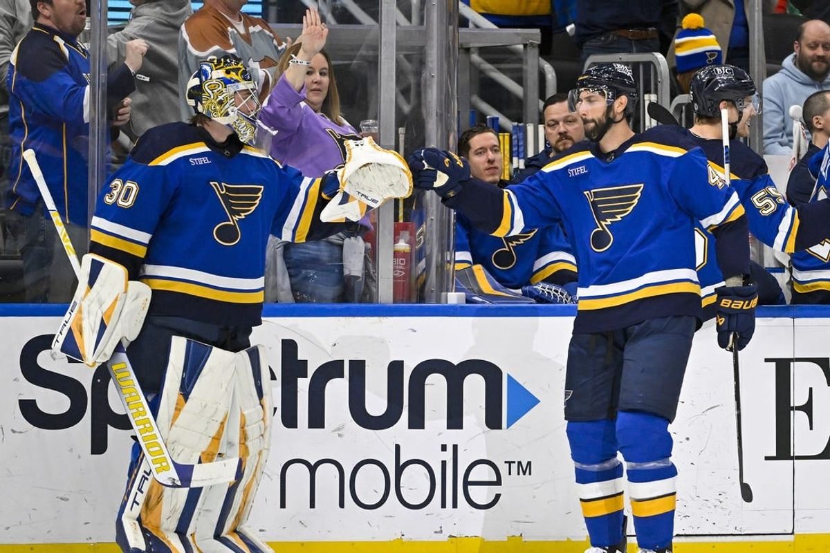 Mar 21, 2023; St. Louis, Missouri, USA;  St. Louis Blues defenseman Robert Bortuzzo (41) is congratulated by goaltender Joel Hofer (30) after scoring against the Detroit Red Wings during the first period at Enterprise Center.