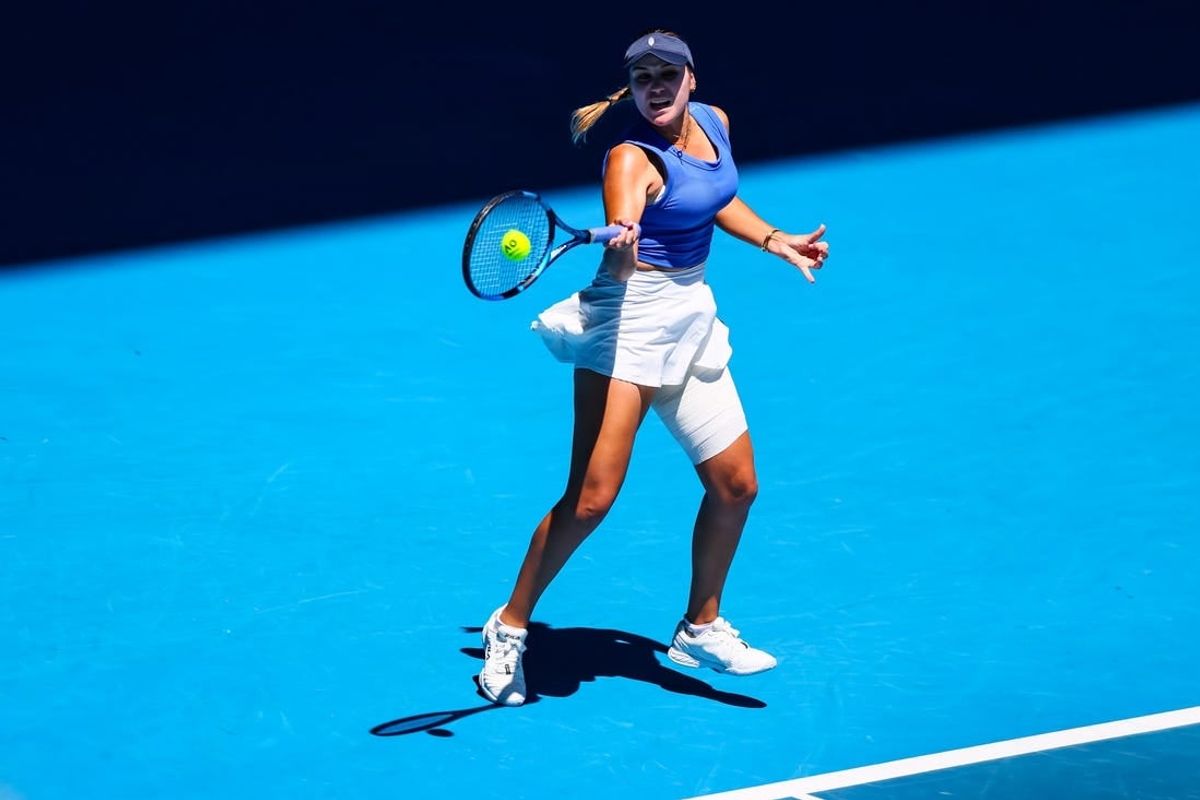Jan 16, 2024; Melbourne, Victoria, Australia; Sofia Kenin of the United States plays a shot against Iga Swiatek (not pictured) of the Poland in Round 1 of the Women's Singles on Day 3 of the Australian Open tennis at Rod Laver Arena.