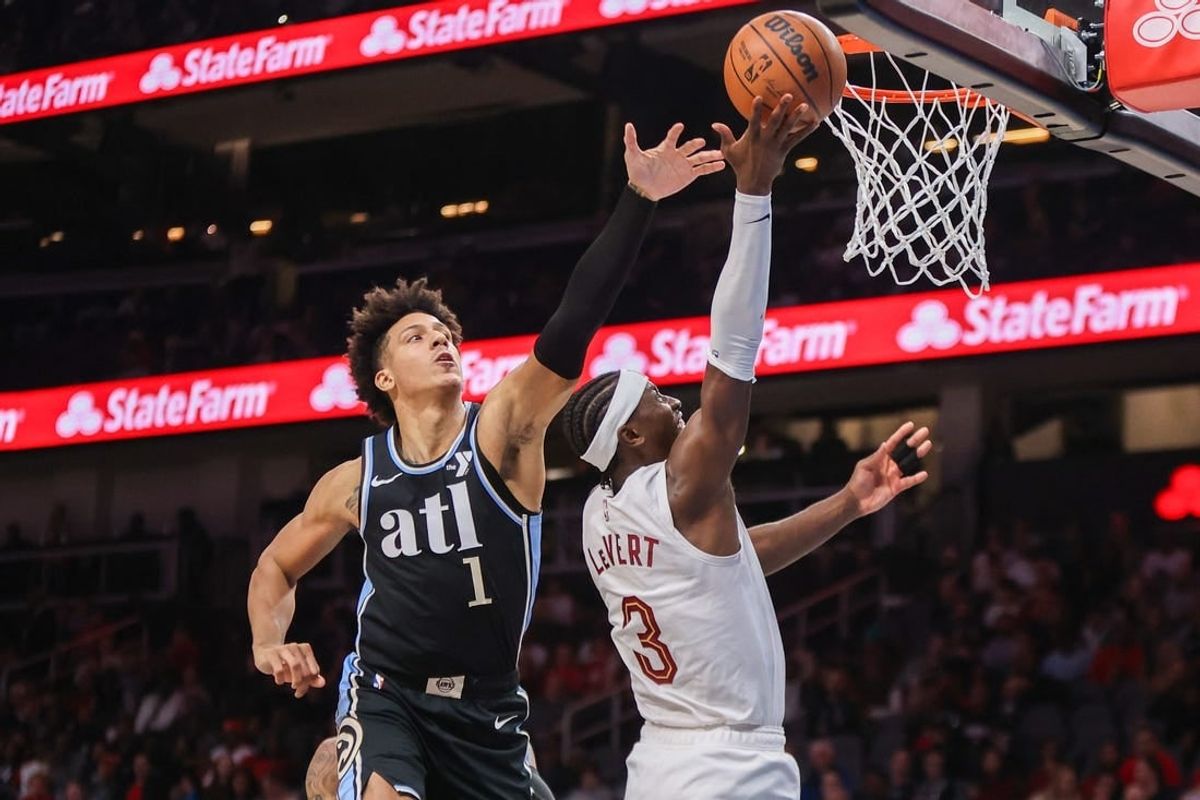 Mar 6, 2024; Atlanta, Georgia, USA; Cleveland Cavaliers guard Caris LeVert (3) shoots past Atlanta Hawks forward Jalen Johnson (1) in the second quarter at State Farm Arena.