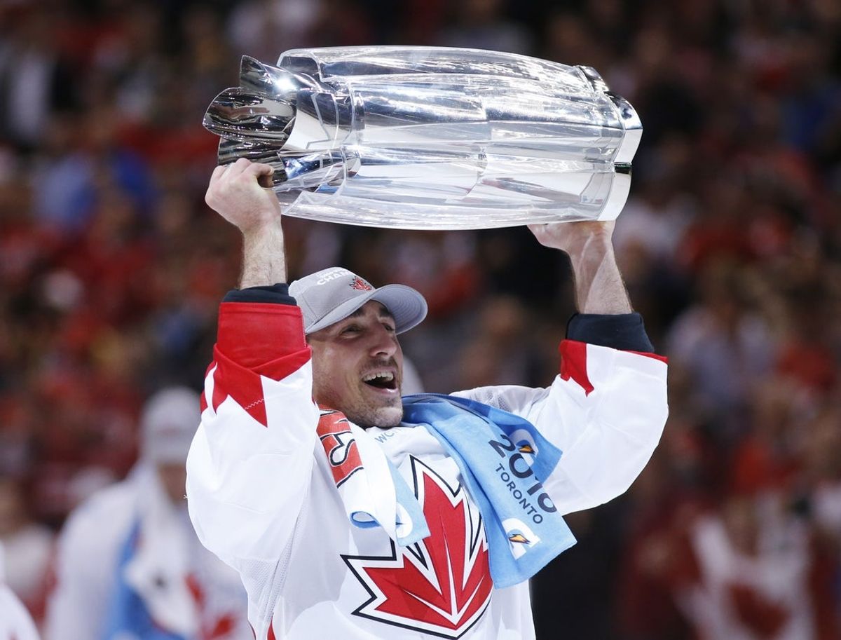 Sep 29, 2016; Toronto, Ontario, Canada; Team Canada center Brad Marchand (63) hoists the championship trophy after game two of the World Cup of Hockey final against Team Europe at Air Canada Centre. Mandatory Credit: Kevin Sousa-Imagn Images