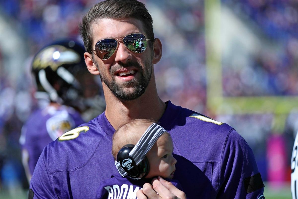 Oct 9, 2016; Baltimore, MD, USA; United States olympian Michael Phelps and his son Boomer attend the Washington Redskins game against the Baltimore Ravens at M&T Bank Stadium. Mandatory Credit: Mitch Stringer-Imagn Images