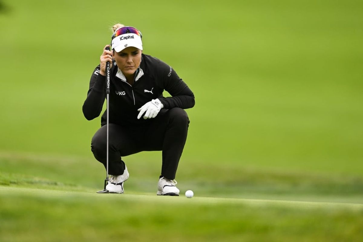 Jul 6, 2023; Pebble Beach, California, USA; Lexi Thompson lines up her putt on the 16th hole during the first round of the U.S. Women's Open golf tournament at Pebble Beach Golf Links.