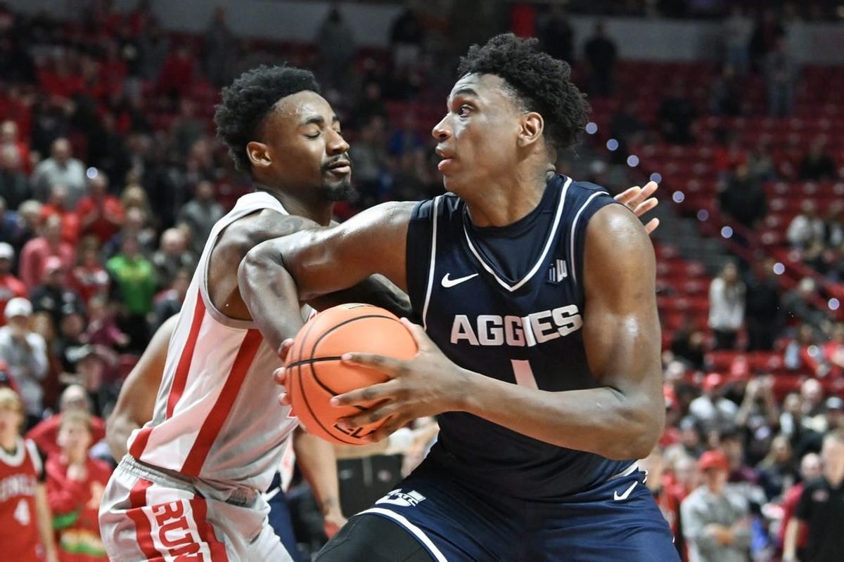Jan 13, 2024; Las Vegas, Nevada, USA; Utah State Aggies forward Great Osobor (1) drives to the basket against UNLV Rebels forward Kalib Boone (10) in the second half at Thomas & Mack Center.