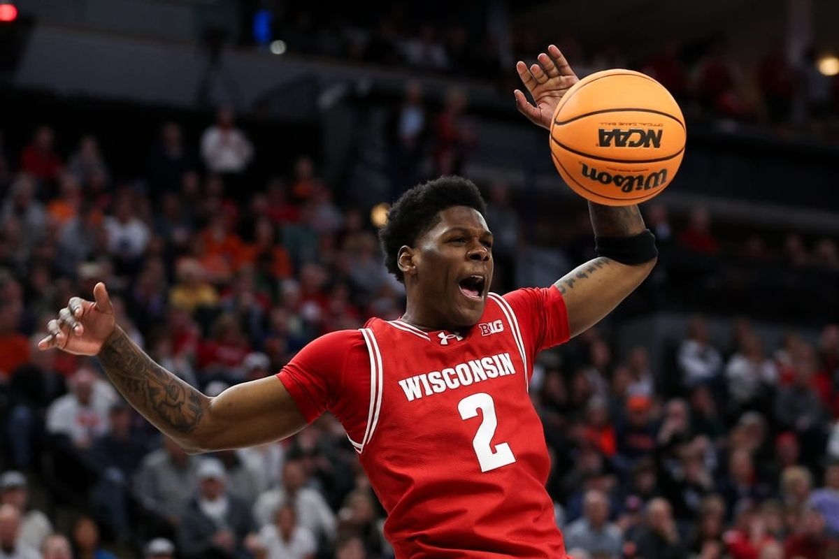 Mar 16, 2024; Minneapolis, MN, USA; Wisconsin Badgers guard AJ Storr (2) celebrates his dunk against the Purdue Boilermakers during the overtime at Target Center.