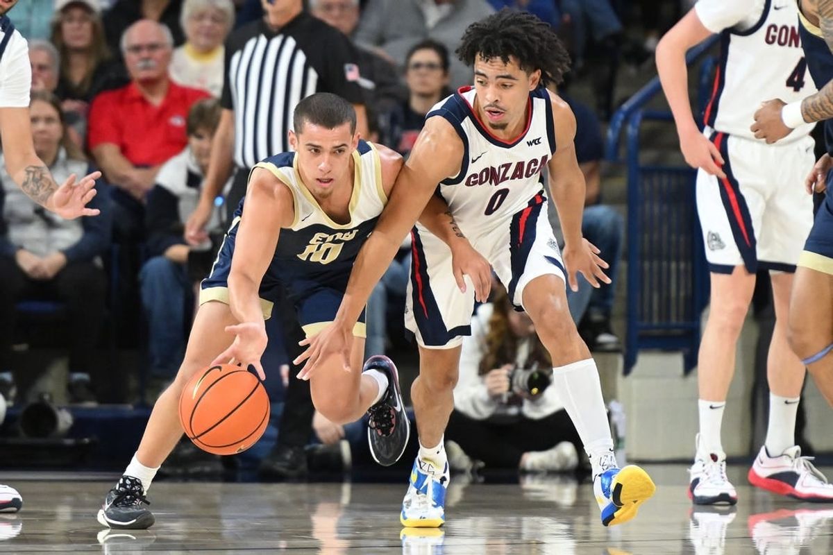 Nov 14, 2023; Spokane, Washington, USA; Gonzaga Bulldogs guard Ryan Nembhard (0) reaches in for the steal attempt against Eastern Oregon Mountaineers guard Malachi Afework (10) in the first half at McCarthey Athletic Center.