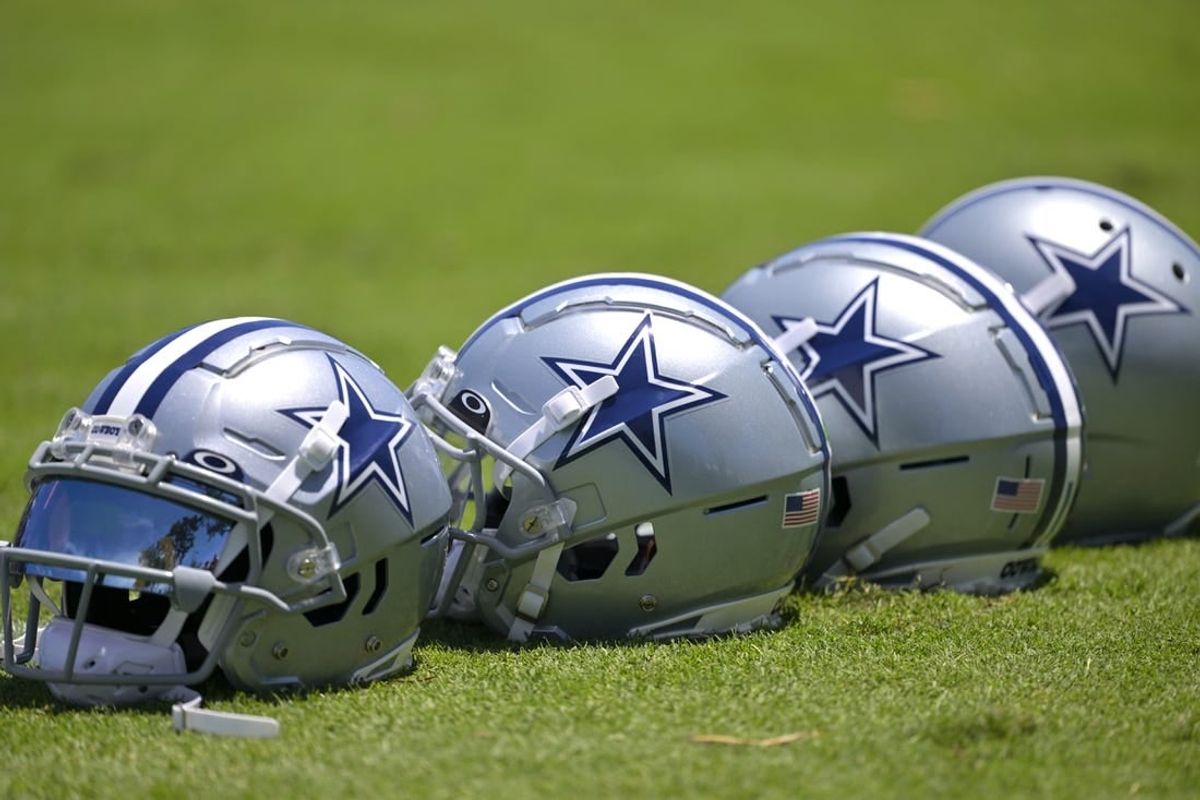 Jul 26, 2023; Oxnard, CA, USA; General view of player helmets on the field during training camp at River Ridge Playing Fields in Oxnard, CA.