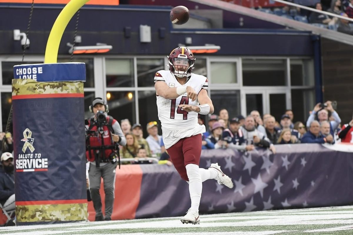 Nov 5, 2023; Foxborough, Massachusetts, USA;  Washington Commanders quarterback Sam Howell (14) throws the ball during the second half against the New England Patriots at Gillette Stadium.