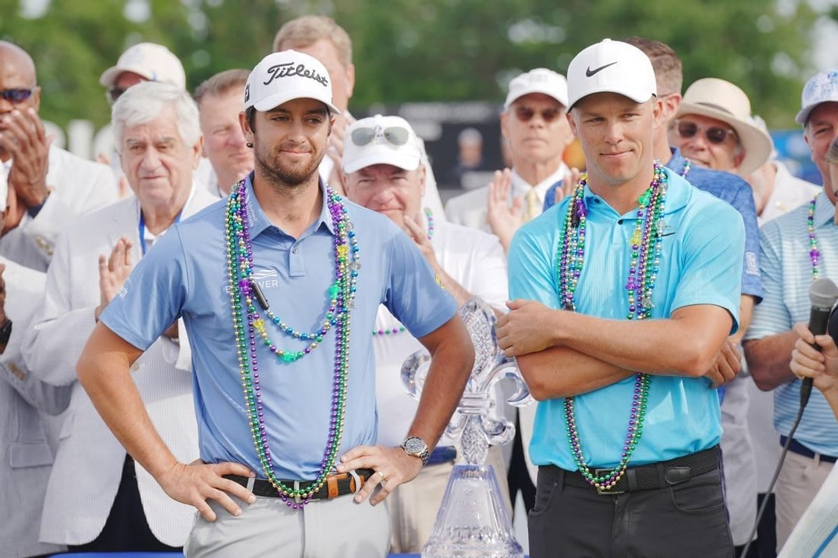 Apr 23, 2023; Avondale, Louisiana, USA; Davis Riley and Nick Hardy celebrate winning the final round of the Zurich Classic of New Orleans golf tournament.