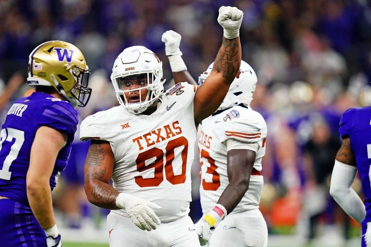 Jan 1, 2024; New Orleans, LA, USA; Texas Longhorns defensive lineman Byron Murphy II (90) celebrates after a play during the second quarter  in the 2024 Sugar Bowl college football playoff semifinal game at Caesars Superdome.