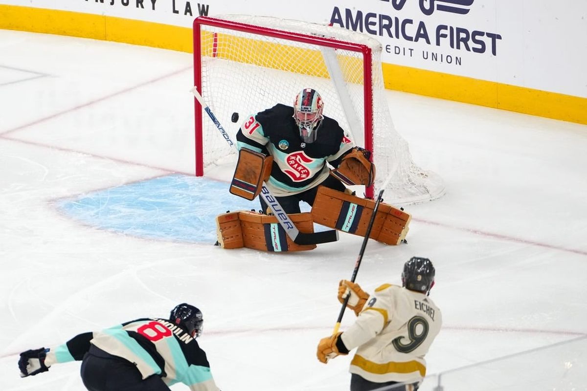 Mar 21, 2024; Las Vegas, Nevada, USA; Seattle Kraken goaltender Philipp Grubauer (31) defends his net against a shot from Vegas Golden Knights center Jack Eichel (9) during the first period at T-Mobile Arena.