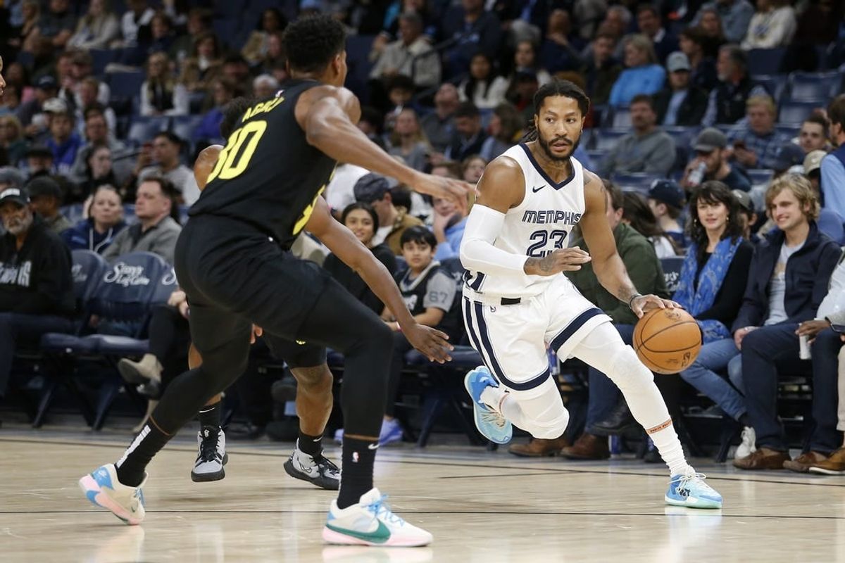 Nov 29, 2023; Memphis, Tennessee, USA; Memphis Grizzlies guard Derrick Rose (23) drives to the basket during the first half against the Utah Jazz at FedExForum.