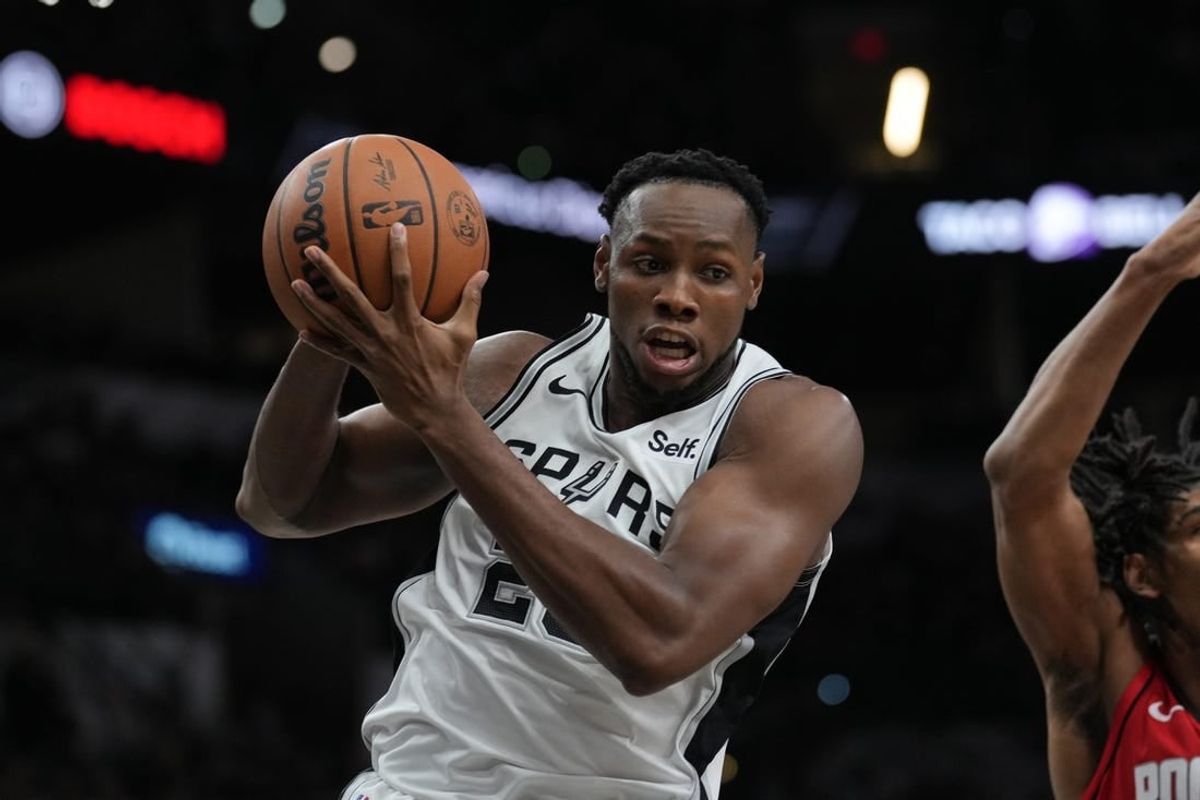 Oct 18, 2023; San Antonio, Texas, USA; San Antonio Spurs center Charles Bassey (28) rebounds in the second half against the Houston Rockets at the Frost Bank Center.