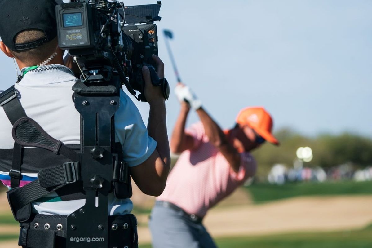 Feb 12, 2023; Scottsdale, Arizona,USA; A general view as the documentary team from Netflix Full Swing works with Rickie Fowler on the range prior to the start of the final round of the WM Phoenix Open golf tournament.