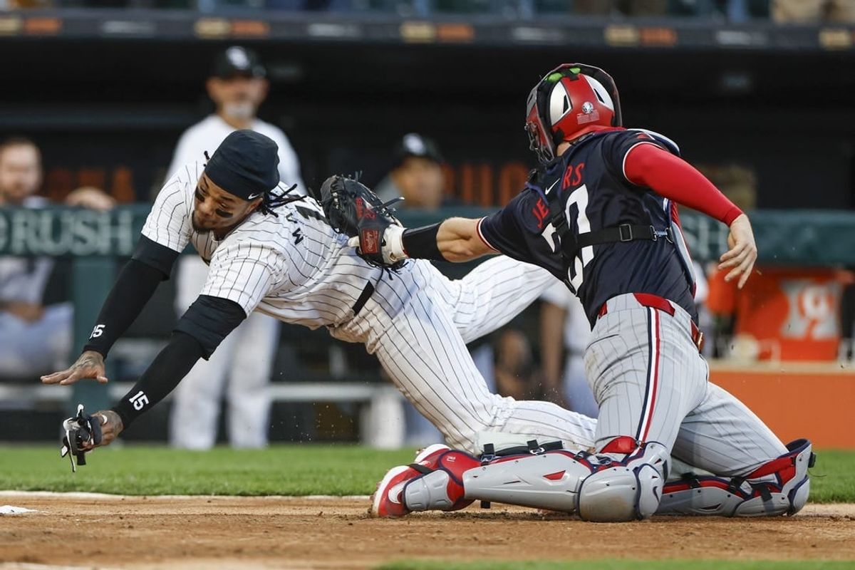 Apr 30, 2024; Chicago, Illinois, USA; Chicago White Sox catcher Martín Maldonado (15) is tagged out by Minnesota Twins catcher Ryan Jeffers (27) at home plate during the third inning at Guaranteed Rate Field.