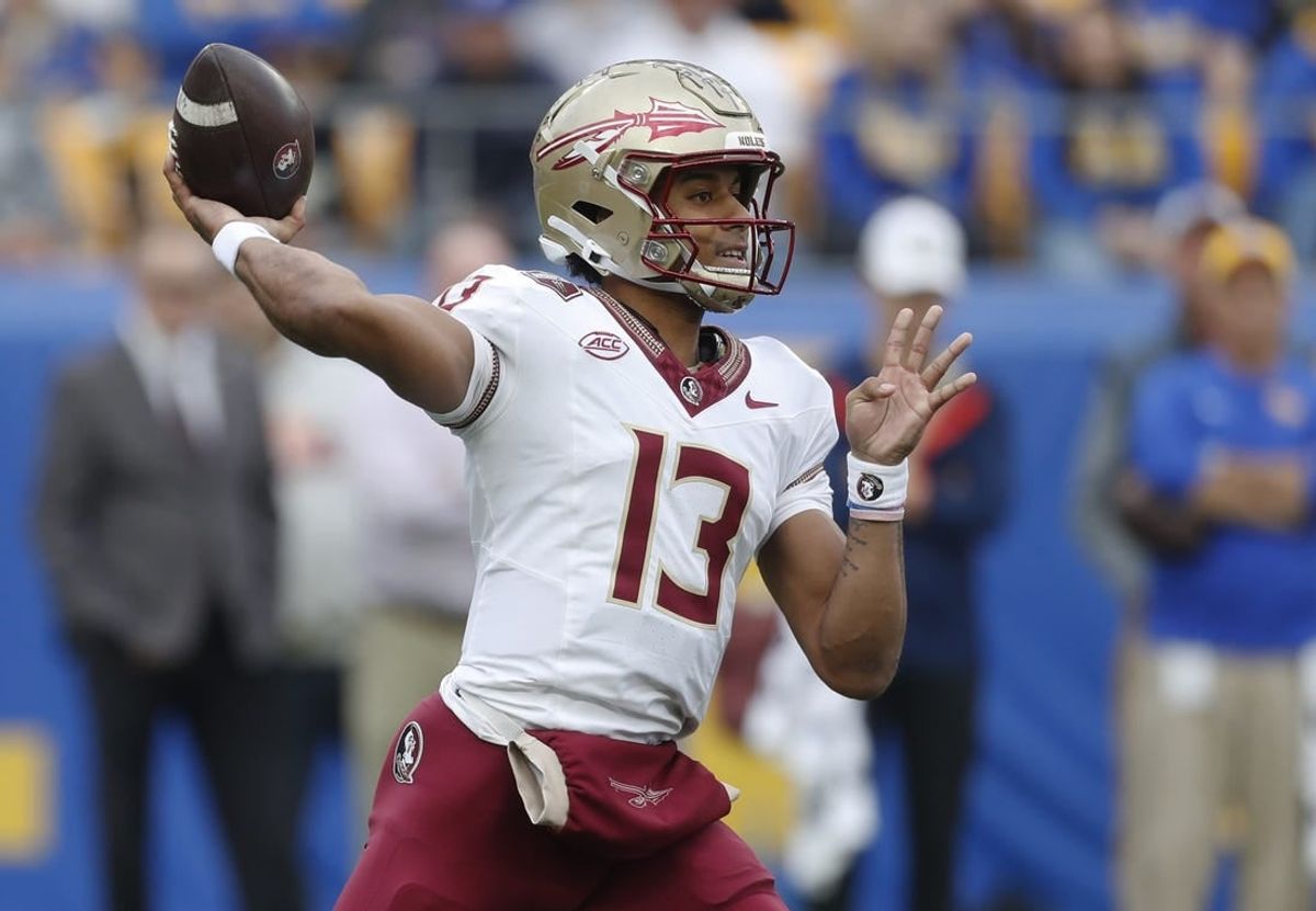 Nov 4, 2023; Pittsburgh, Pennsylvania, USA;  Florida State Seminoles quarterback Jordan Travis (13) passes the ball against the Pittsburgh Panthers during the first quarter at Acrisure Stadium.