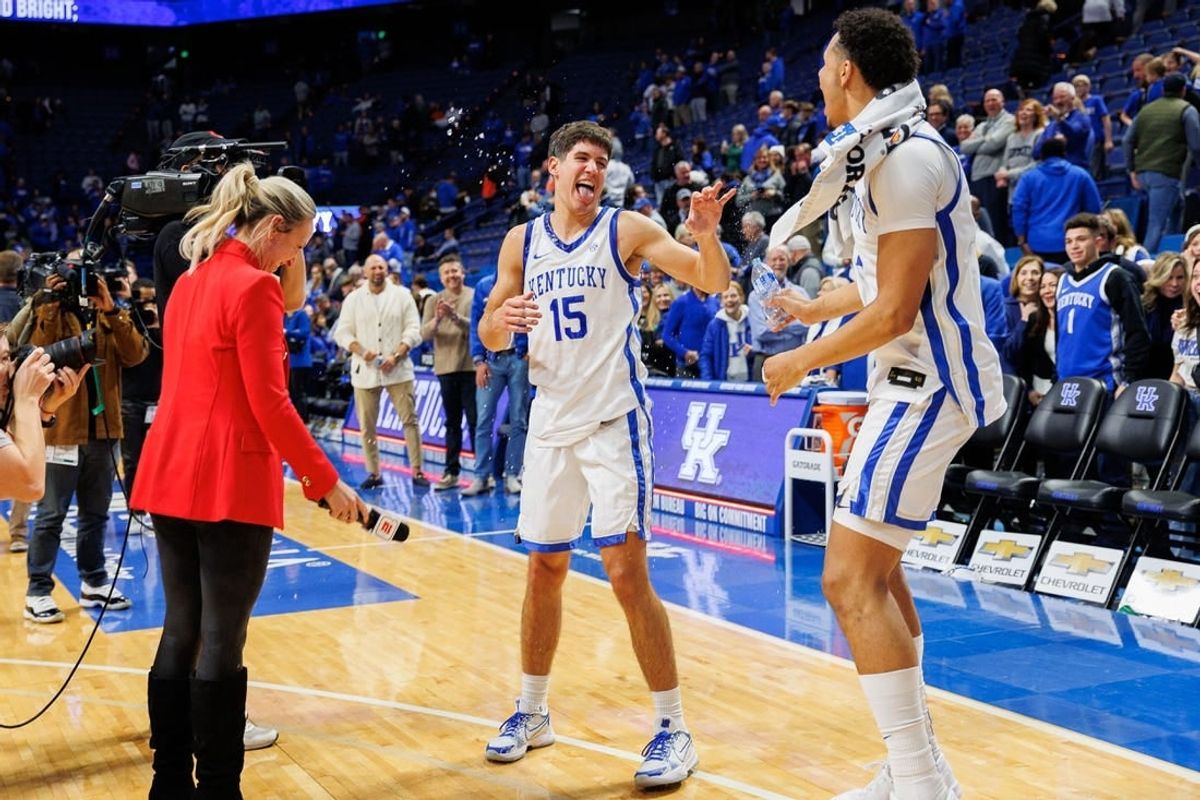 Nov 28, 2023; Lexington, Kentucky, USA; Kentucky Wildcats forward Tre Mitchell (4) dumps water on guard Reed Sheppard (15) after the game against the Miami (Fl) Hurricanes at Rupp Arena at Central Bank Center.
