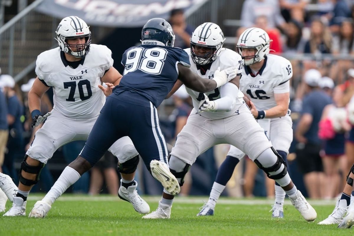 (File photo) Yale Bulldogs offensive lineman Kiran Amegadjie (72) blocks Connecticut Huskies defensive lineman Lwal Uguak (98) during the first half at Rentschler Field at Pratt & Whitney Stadium.