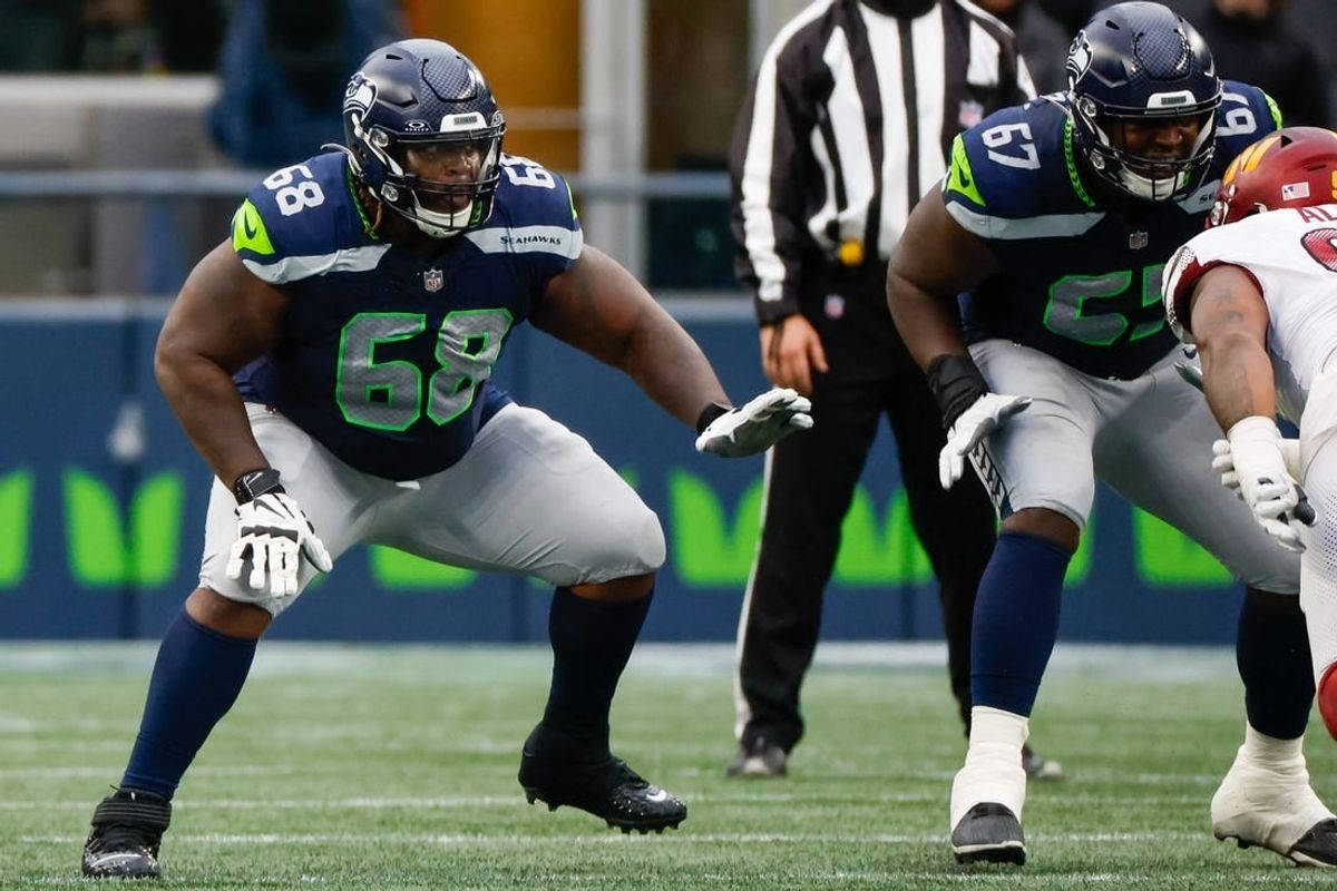 Nov 12, 2023; Seattle, Washington, USA; Seattle Seahawks guard Damien Lewis (68) reacts to a snap against the Washington Commanders during the second quarter at Lumen Field.
