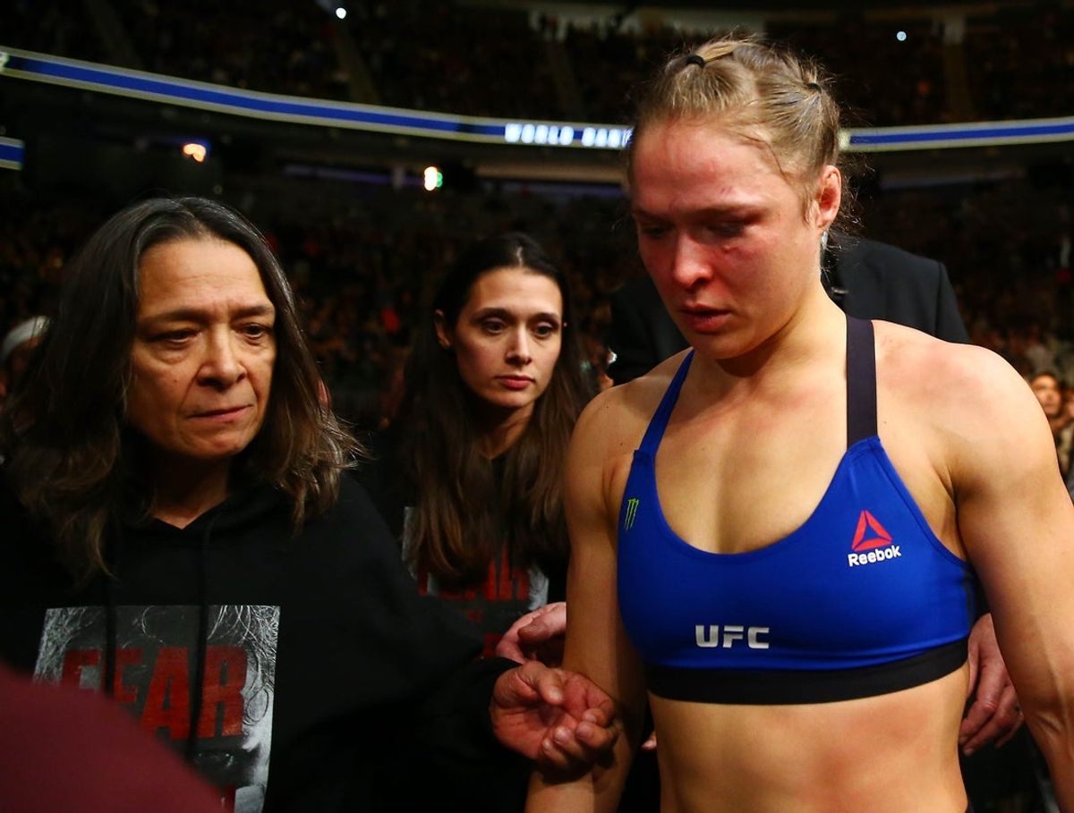 December 30, 2016; Las Vegas, NV, USA; Ronda Rousey leaves with her mother AnnMaria DeMars follwing her loss against Amanda Nunes during UFC 207 at T-Mobile Arena. Mandatory Credit: Mark J. Rebilas-Imagn Images