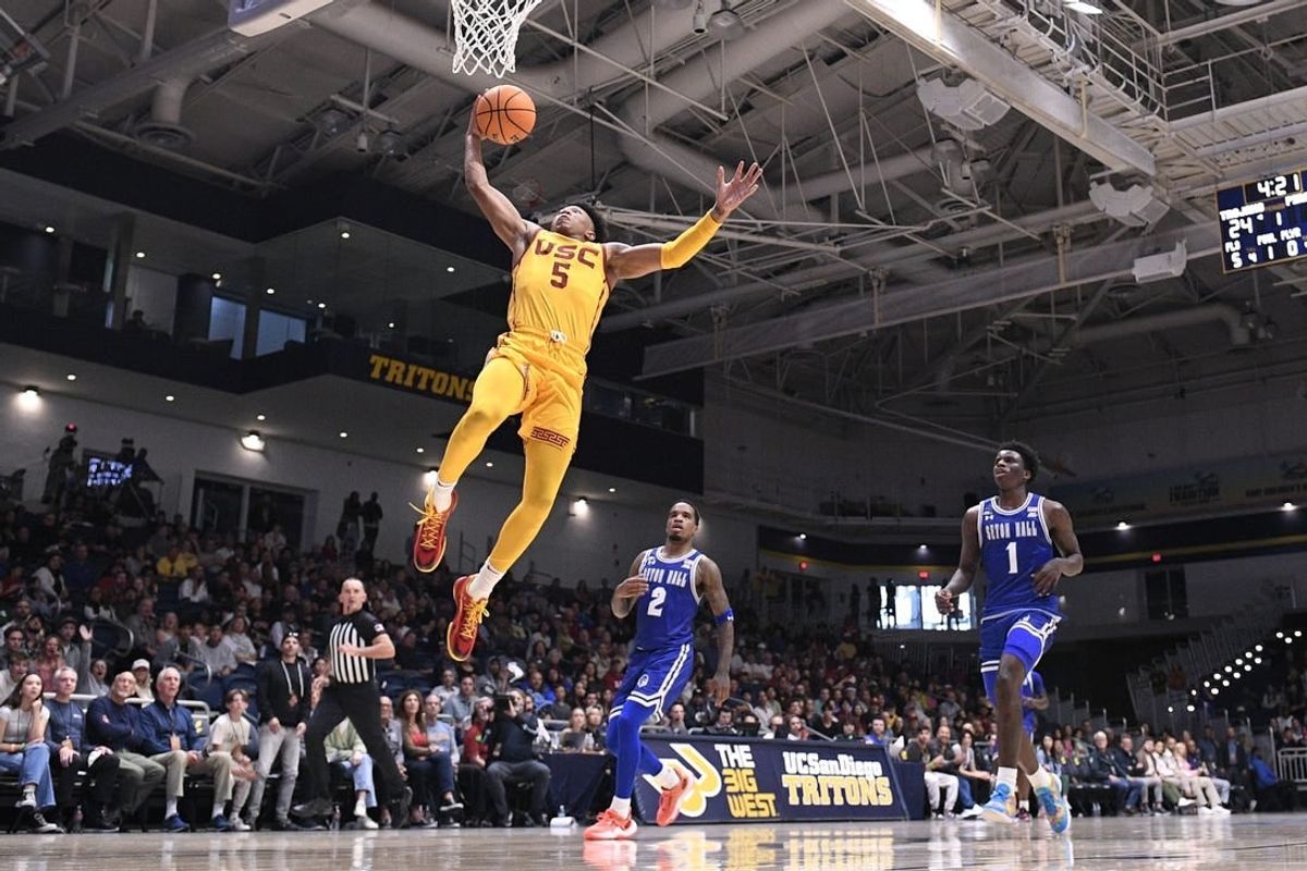 Nov 23, 2023; La Jolla, California, USA; USC Trojans guard Boogie Ellis (5) goes to the basket ahead of Seton Hall Pirates guard Al-Amir Dawes (2) and guard Kadary Richmond (1) during the first half at LionTree Arena.