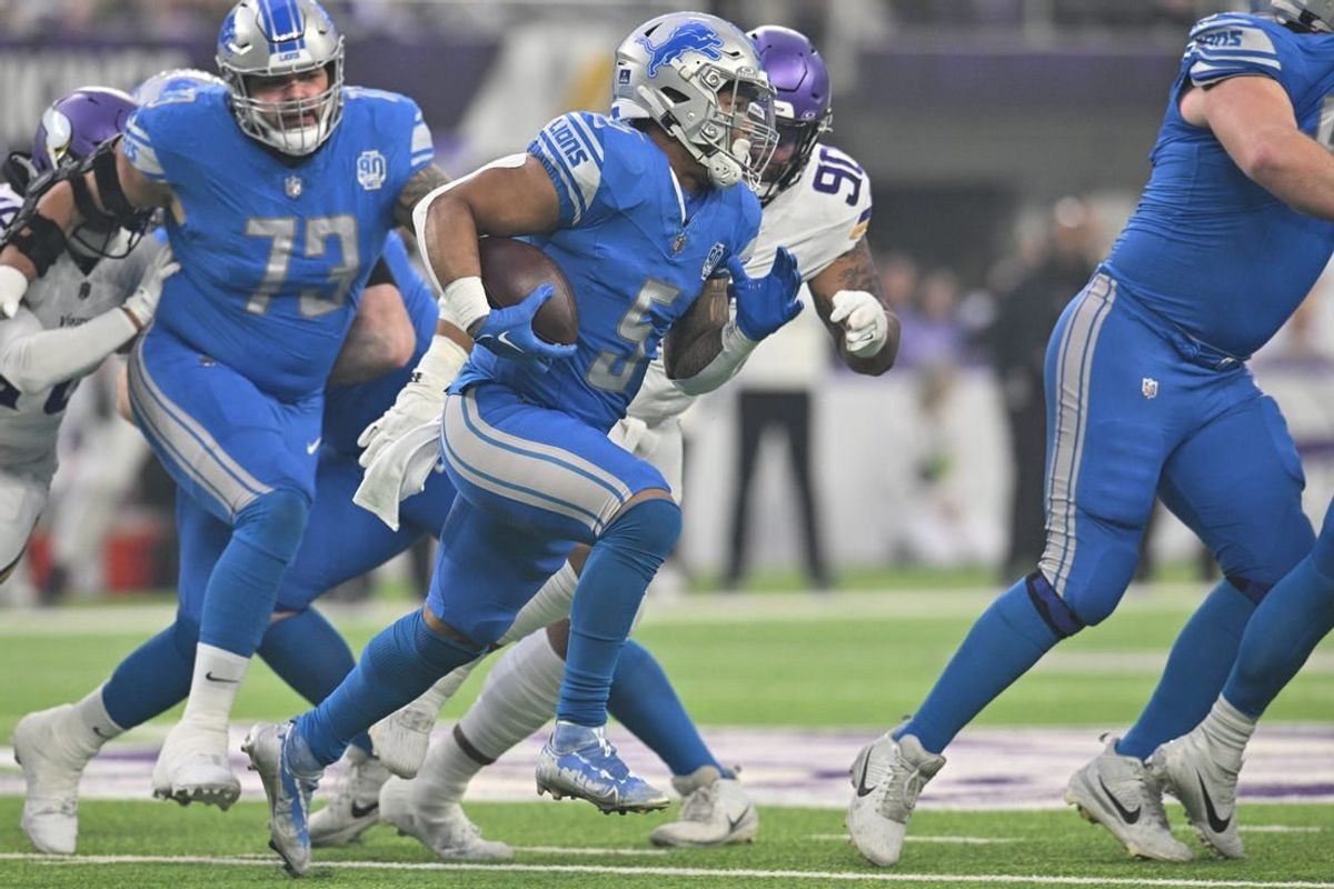 Dec 24, 2023; Minneapolis, Minnesota, USA; Detroit Lions running back David Montgomery (5) runs the ball as Minnesota Vikings defensive end Jonathan Bullard (90) chases during the first quarter at U.S. Bank Stadium.