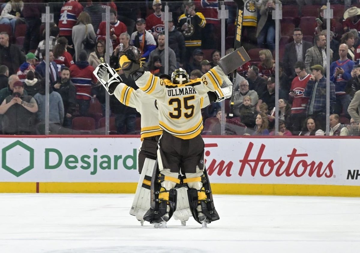 Mar 14, 2024; Montreal, Quebec, CAN; Boston Bruins goalie Linus Ullmark (35) celebrates with teammate goalie Jeremy Swayman (1) the win against the Montreal Canadiens in overtime at the Bell Centre.